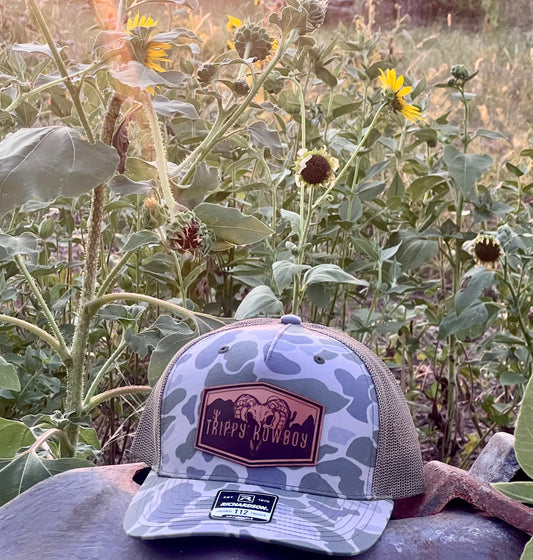 Trippy Kowboy leather patch Camo trucker hat